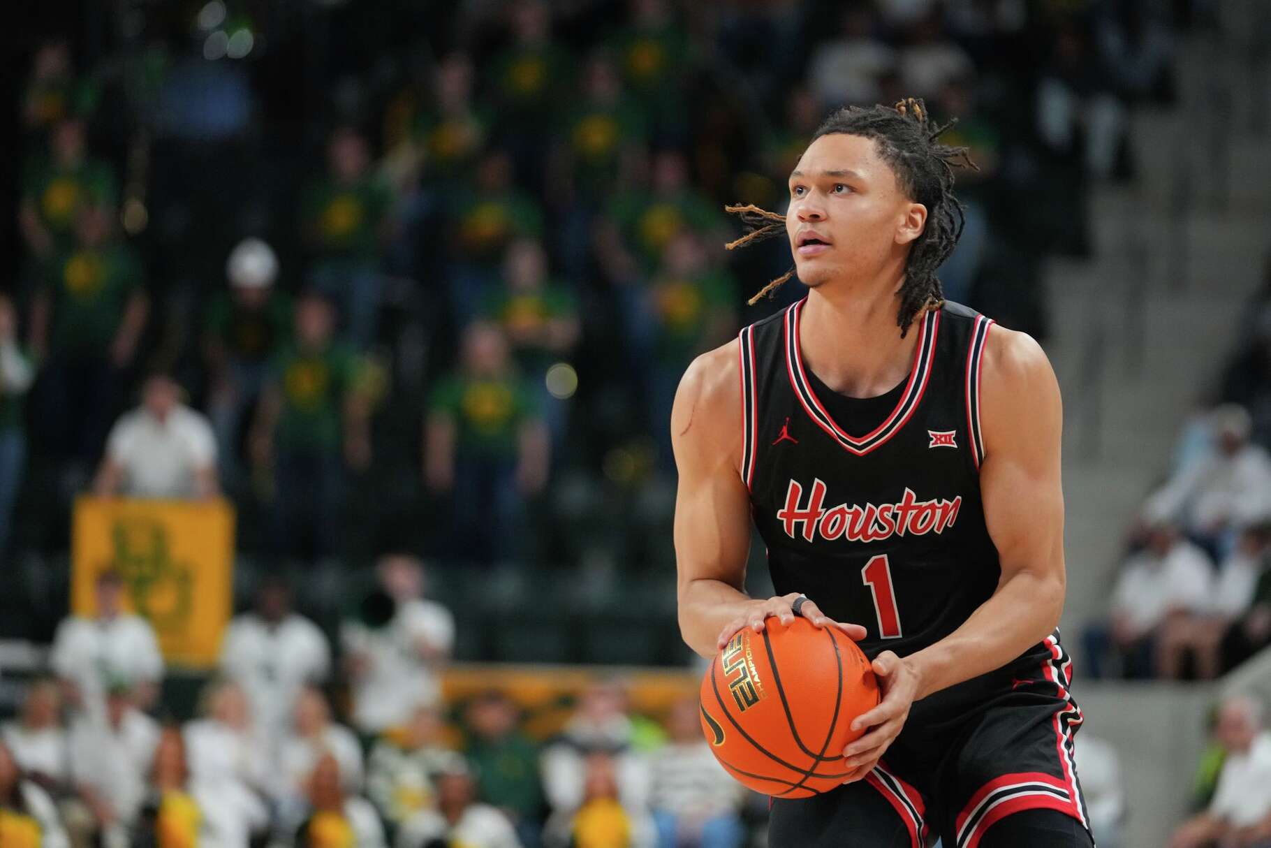 Houston guard Isiah Harwell (1) prepares to shoot against Baylor during the first half of an NCAA college basketball game Saturday, Jan. 10, 2026, in Waco. (AP Photo/Julio Cortez)