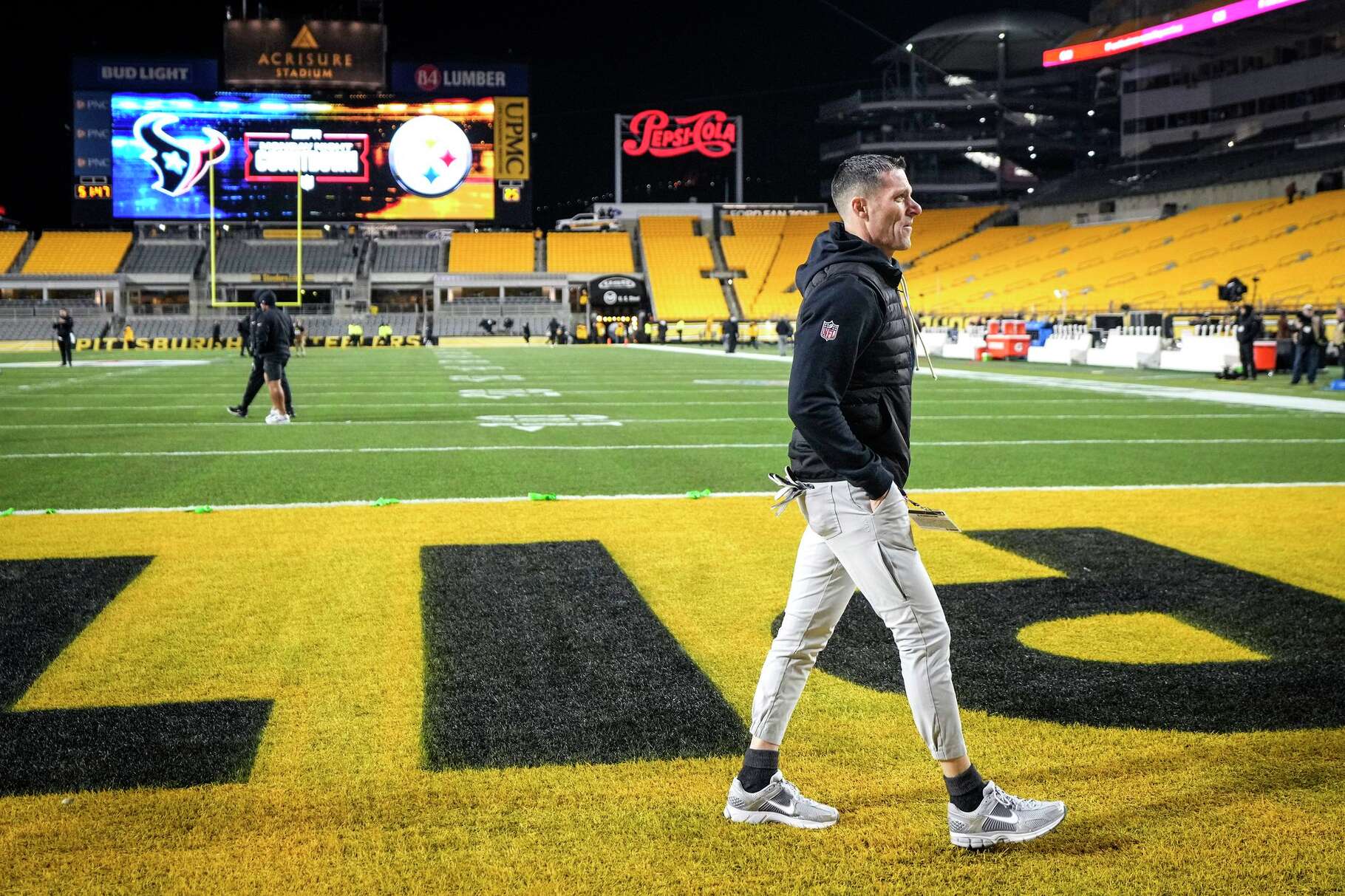 Houston Texans general manager Nick Caserio walks on the field before an NFL wild-card playoff football game against the Pittsburgh Steelers in Pittsburgh, Monday, Jan. 12, 2026.