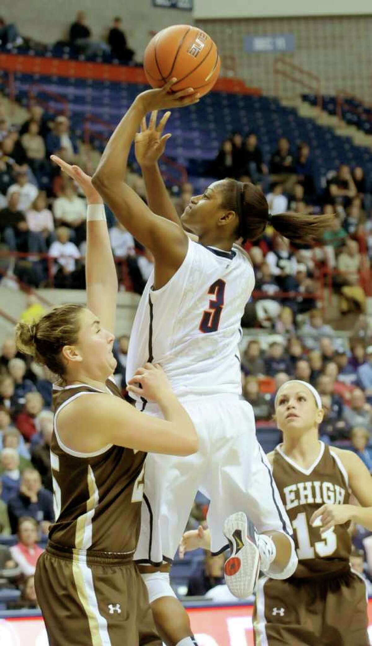 Connecticut's Tiffany Hayes (3) takes a jump shot over Lehigh's Kristen Dalton during the second half of an NCAA college basketball game at Storrs, Conn., Saturday, Nov. 27, 2010. UConn defeated Lehigh 81-38. (AP Photo/Bob Child)