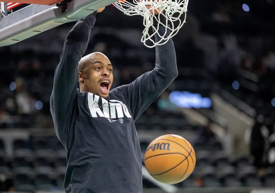 San Antonio Spurs forward Keldon Johnson (3) dunks the ball during warmups in a home game against the Milwaukee Bucks at Frost Bank Center in San Antonio, Thursday, Jan. 15, 2026.