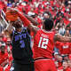 BYU forward AJ Dybantsa (3) has a shot attempt blocked by Texas Tech forward Donovan Atwell (12) during the second half of an NCAA college basketball game Saturday, Jan. 17, 2026, in Lubbock, Texas. (AP Photo/Chase Seabolt)