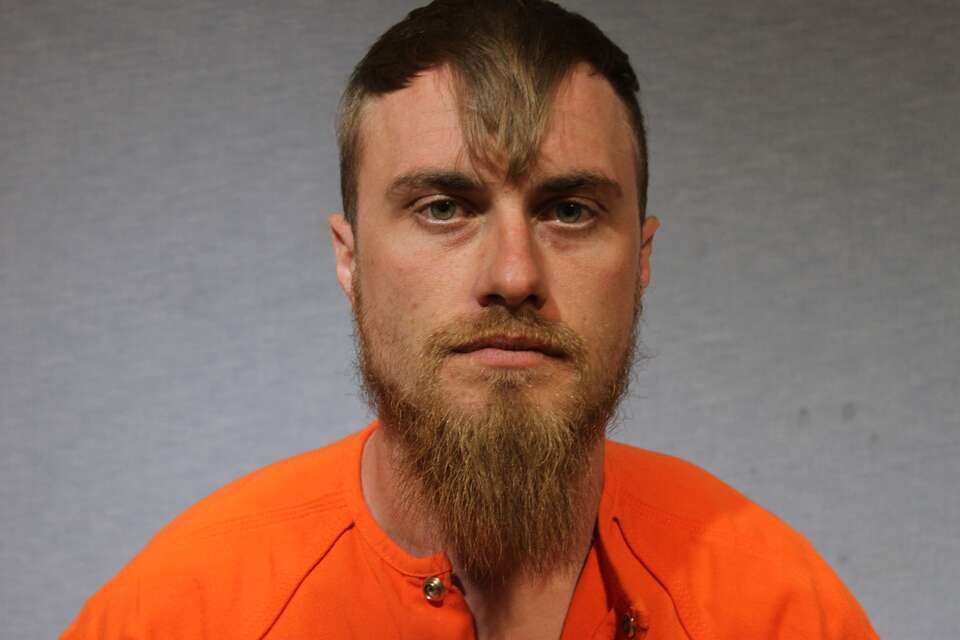 Man arrested in woman's fatal shooting at Garland gas station