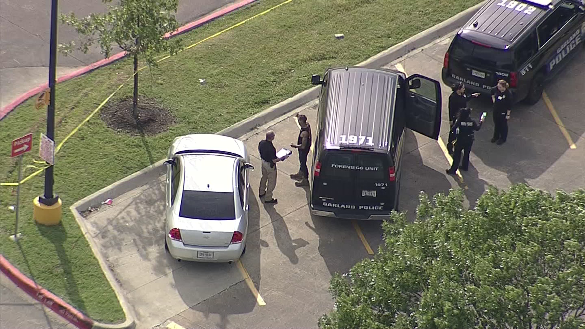 Man arrested in woman's fatal shooting at Garland gas station