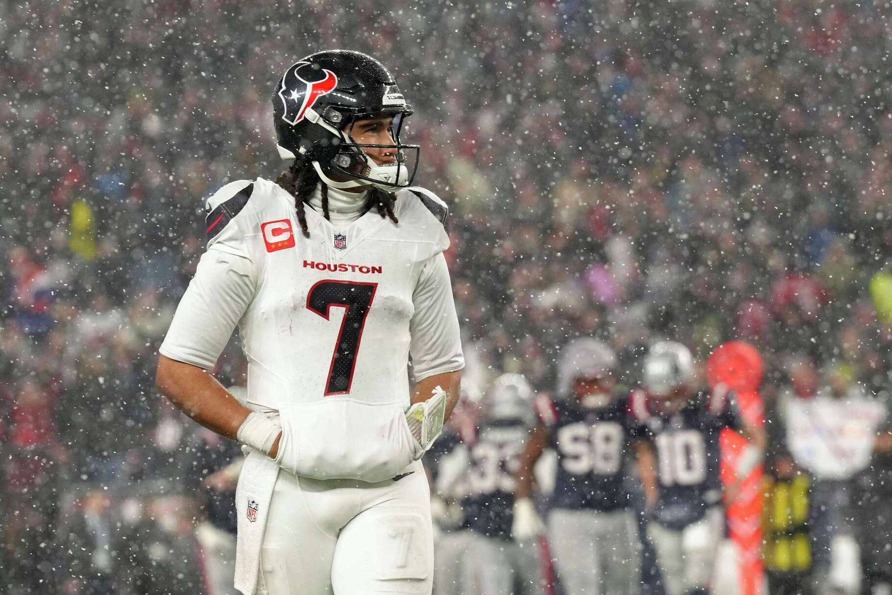 Houston Texans quarterback C.J. Stroud (7) walks off the field toward the sideline in the closing moment of the second half of an NFL divisional playoff football game in Foxborough, Mass., Sunday, Jan. 18, 2026.