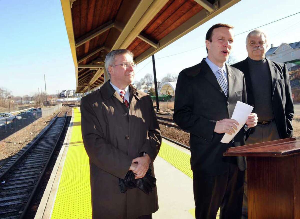 U.S. Rep. Chris Murphy, center, flanked by Bethel First Selectman Matt Knickerbocker, left and state Rep. Bob Godfrey, speaks at a press conference he called at the Danbury train station to address recent remarks by Gov. M. Jodi Rell about closing the Danbury line. Photo taken Monday, Nov. 29, 2010.