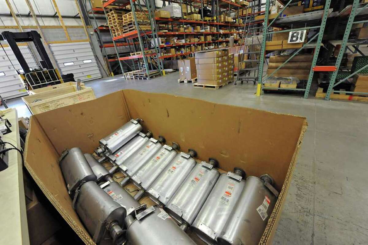 Mufflers sit in a box in the warehouse at Atlantic British Ltd. in Clifton Park, NY on November 29, 2010. Atlantic British is a large online retailer based in Clifton Park. (Lori Van Buren / Times Union)