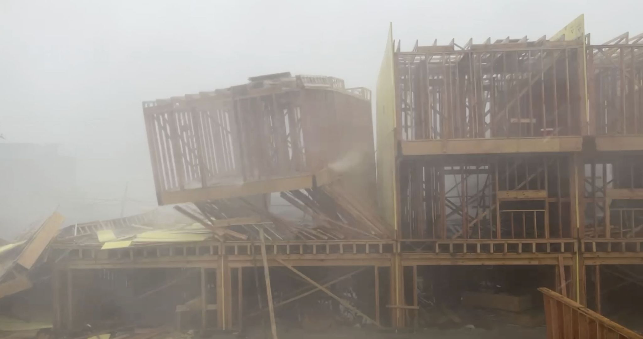 Video shows townhomes under construction blowing over by storms