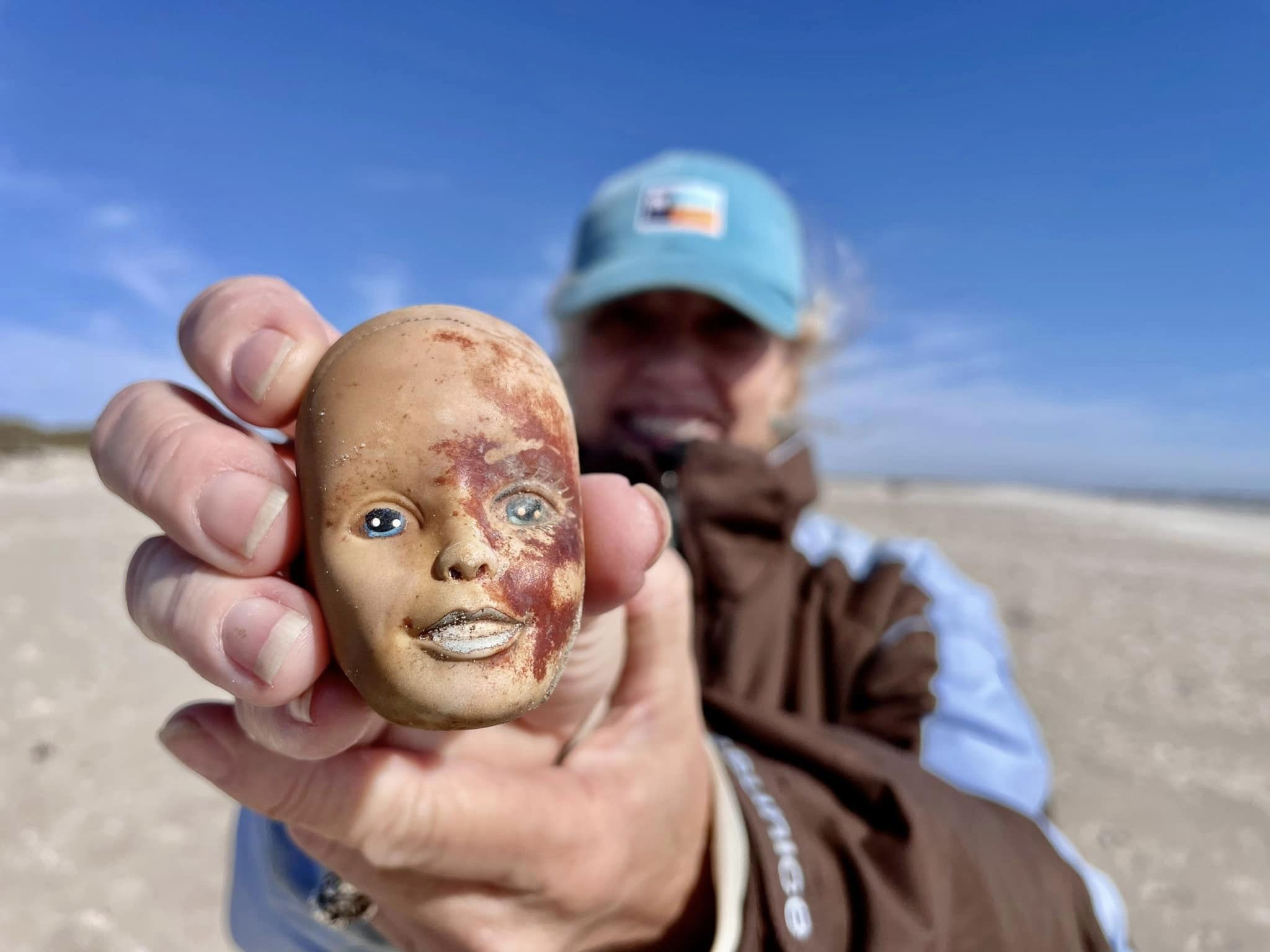 A 40-mile stretch of the Texas gulf shore is littered with creepy looking  dolls. Why?