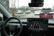 A Tesla Robotaxi drives on East Riverside Drive early this year.
