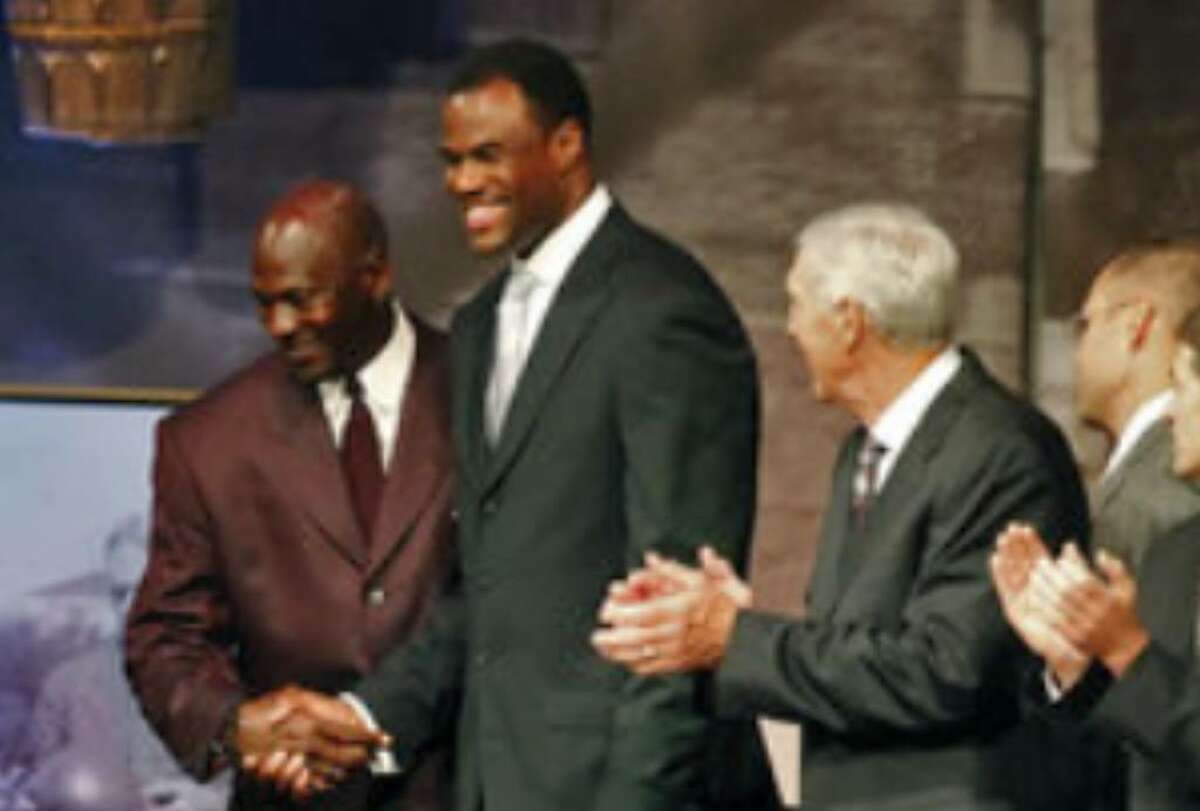 David Robinson (second from left) greets fellow inductee Michael Jordan alongside the rest of this year's class at the reunion dinner Thursday night.