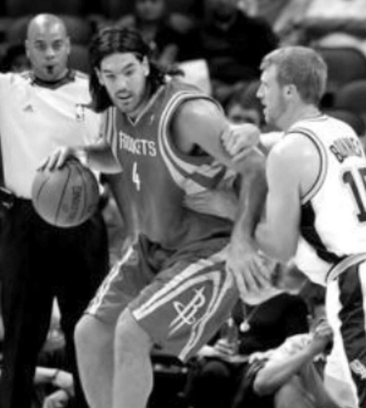 The Rockets' Luis Scola (left) is defended by the Spurs' Matt Bonner in the first half of Tuesday's preseason opener at the AT&T Center. Bonner scored 14 points.