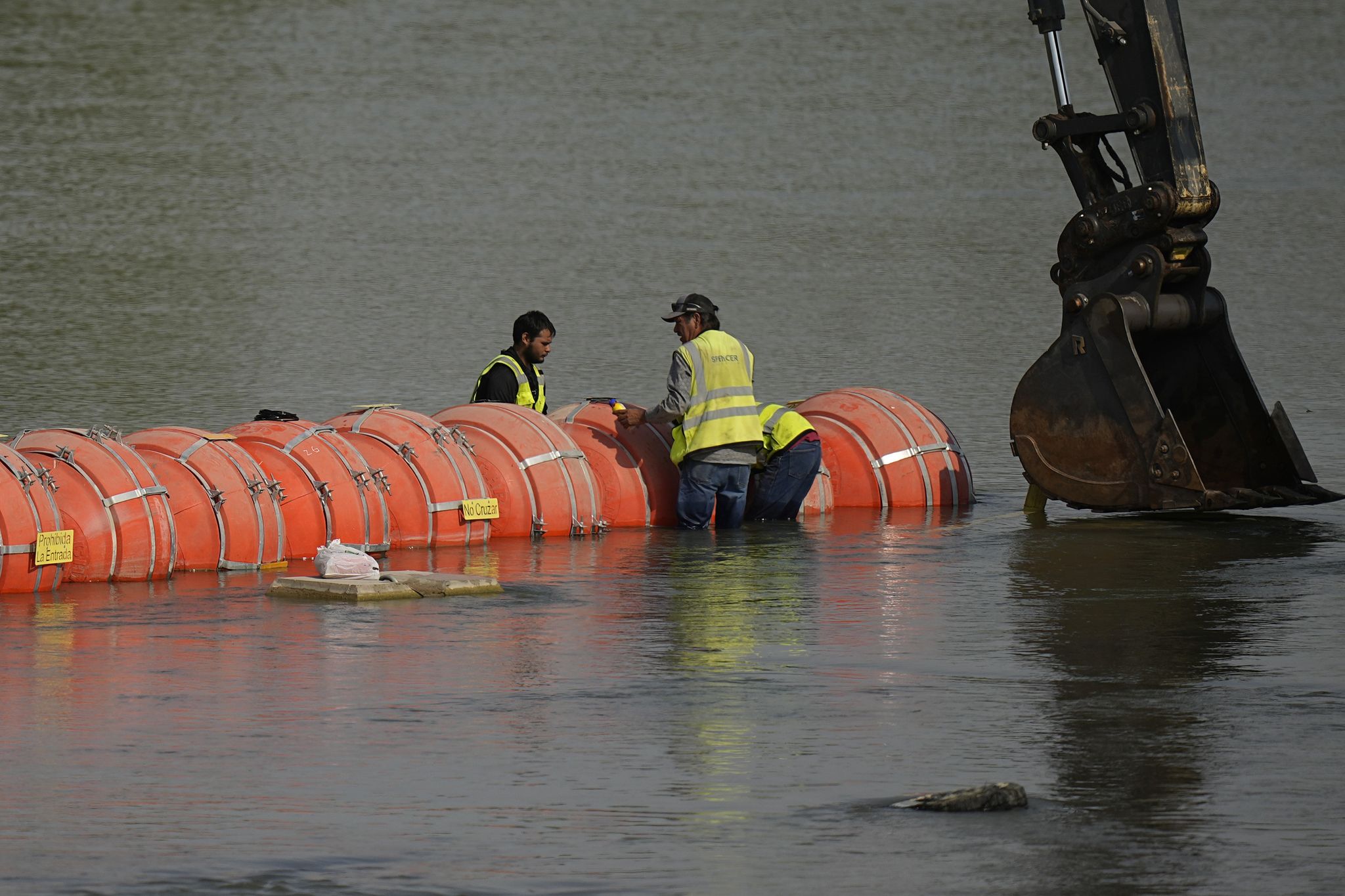 Judge orders Texas to remove border buoys, rejects 'invasion' claim