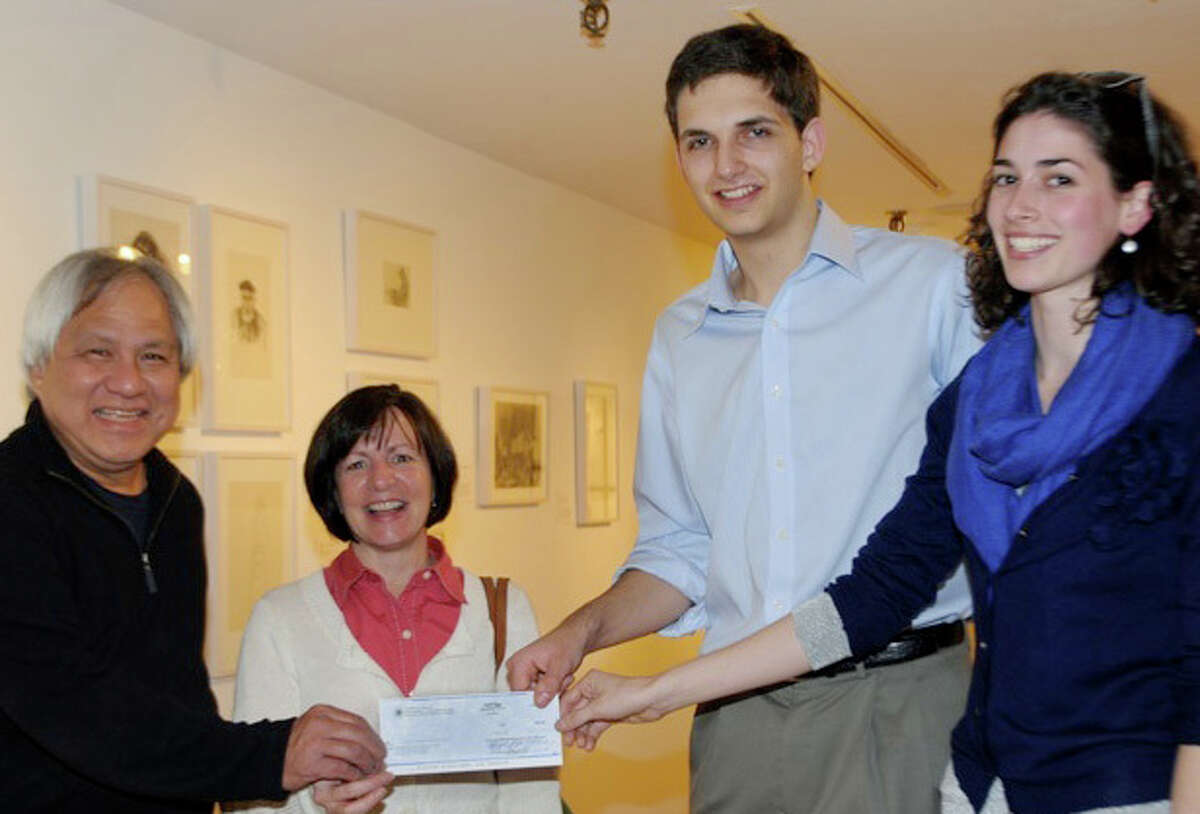 Westport Sunrise Rotary members, from left, Dennis Wong and Nancy von Euler present a check to Westport Youth Film Festival Director Matt Kalmas and WYFF Program Director Kate Lupo.