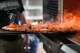 A pizza comes out of the oven at Fortunate Son on Thursday, March 21, 2024, in Garland.