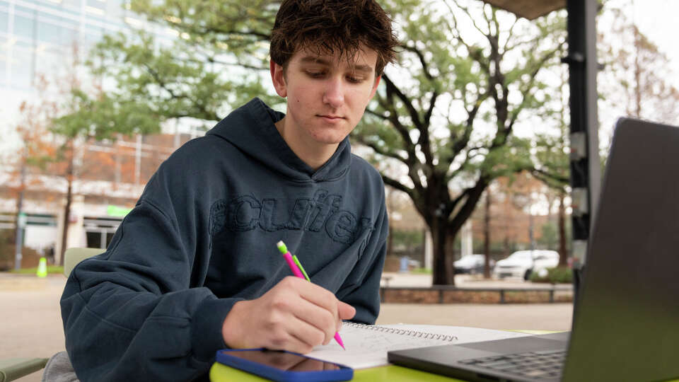 Fort Bend ISD student Gage Fagan works on his homework in Houston, Wednesday, Jan. 21, 2026. Several Houston-area school districts are implementing AI surveillance software platforms, like GoGuardian and Lightspeed Systems, that monitor what students type online and market themselves as being able to detect self-harm and suicidal ideation. Many community members, including students like Fagan, believe the implementation of those platforms are controversial citing several issues, including privacy concerns.