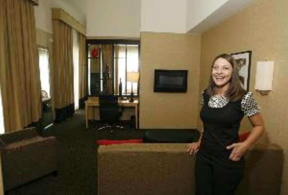 General manager Sonya Garcia shows off one of the suites at the Cambria Suites Hotel, which opened in December near the San Antonio International Airport.
