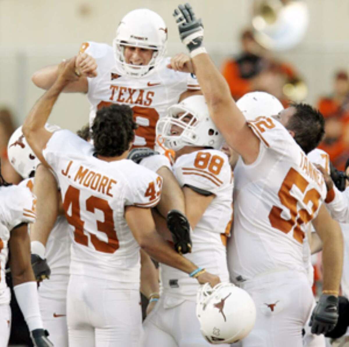Texas' Ryan Bailey (being carried by teammates) hit the game-winning field goal as time expired in 2007 to give the Longhorns a 38-35 win in Stillwater, Okla.
