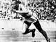Jesse Owens competes in one of the heats of the 200-meter run at the 1936 Olympic Games in Berlin. Owens' victory was not acknowledged by President Franklin D. Roosevelt. A reader shares how politics has infiltrated sports throughout history.