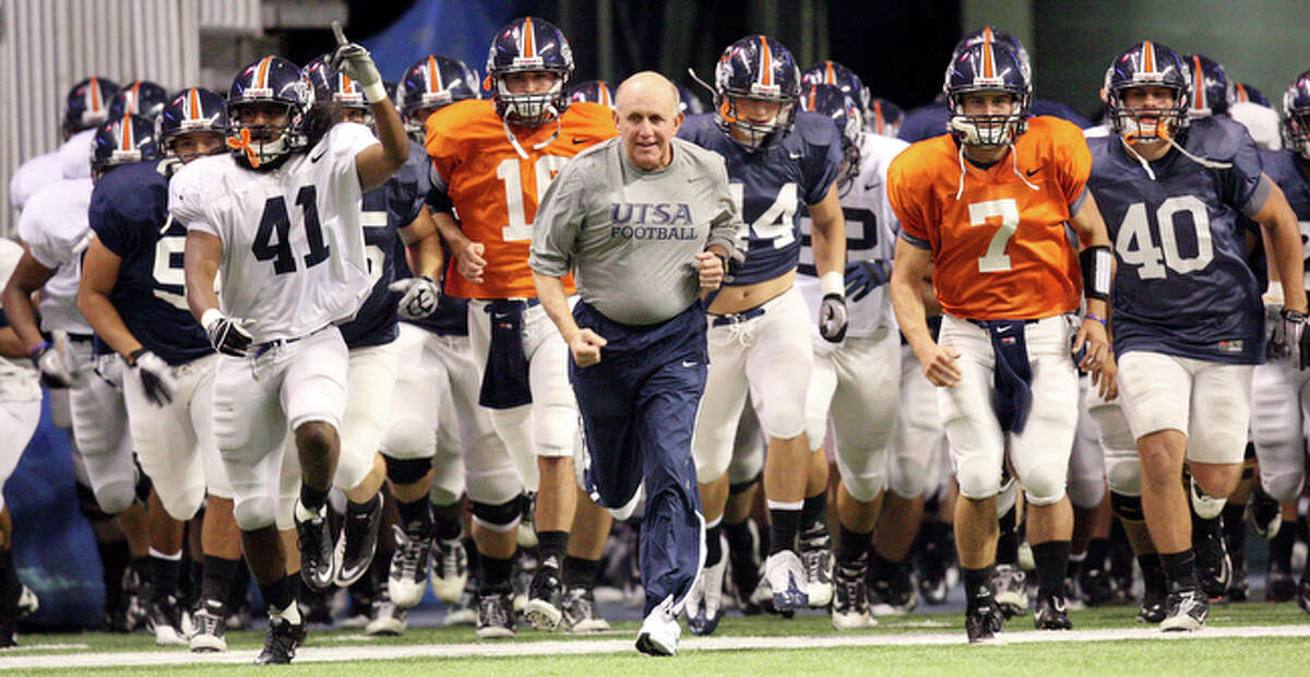 UTSA's head coach Larry Coker (center) leads the team onto the field Thursday Nov 18, 2010 before the scrimmage at the Alamodome.