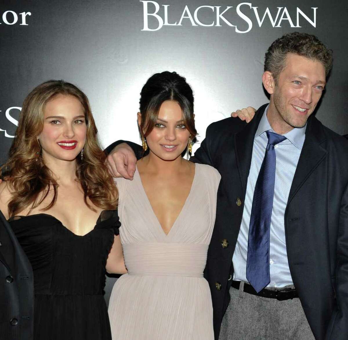Actress Natalie Portman, left, actress Mila Kunis and actor Vincent Cassel, right, attend the premiere of 'Black Swan' at the Ziegfeld Theatre on Tuesday, Nov. 30, 2010 in New York. (AP Photo/Evan Agostini)