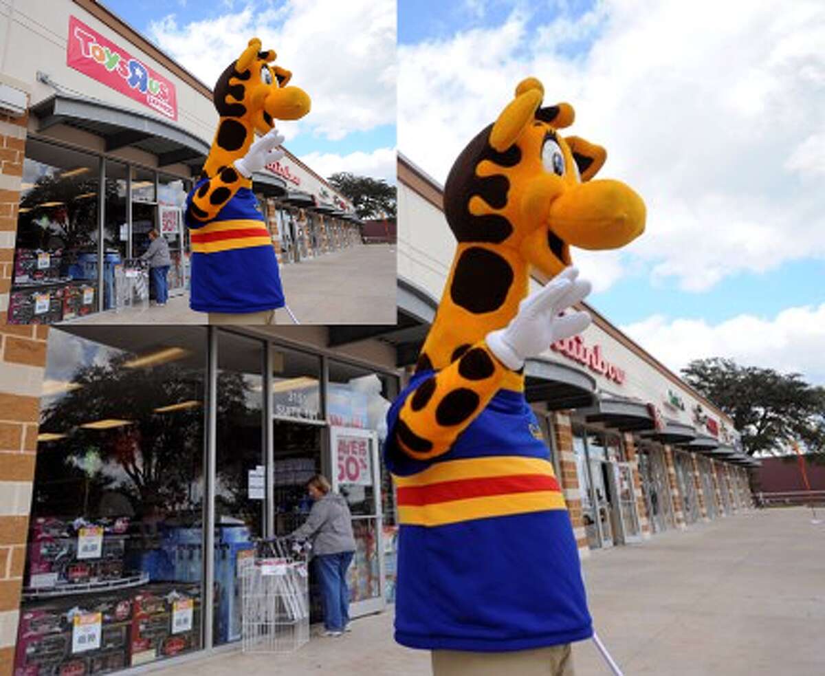 "Geoffrey," the mascot of Toys R Us, greets customers at Toys R Us Express on Southeast Military at Interstate 37.