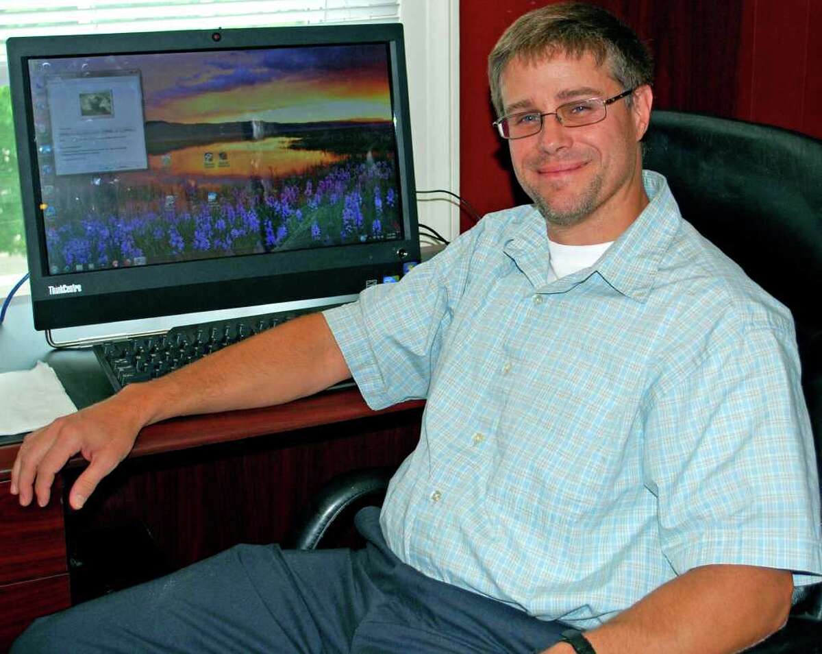 SPECTRUM/Tom Barkal is the man behind New Milford business InfoPlexus, which provides all types of automation services and personal computing products. For Greater New Milford Chamber of Commerce Business Quarterly, December 2010.