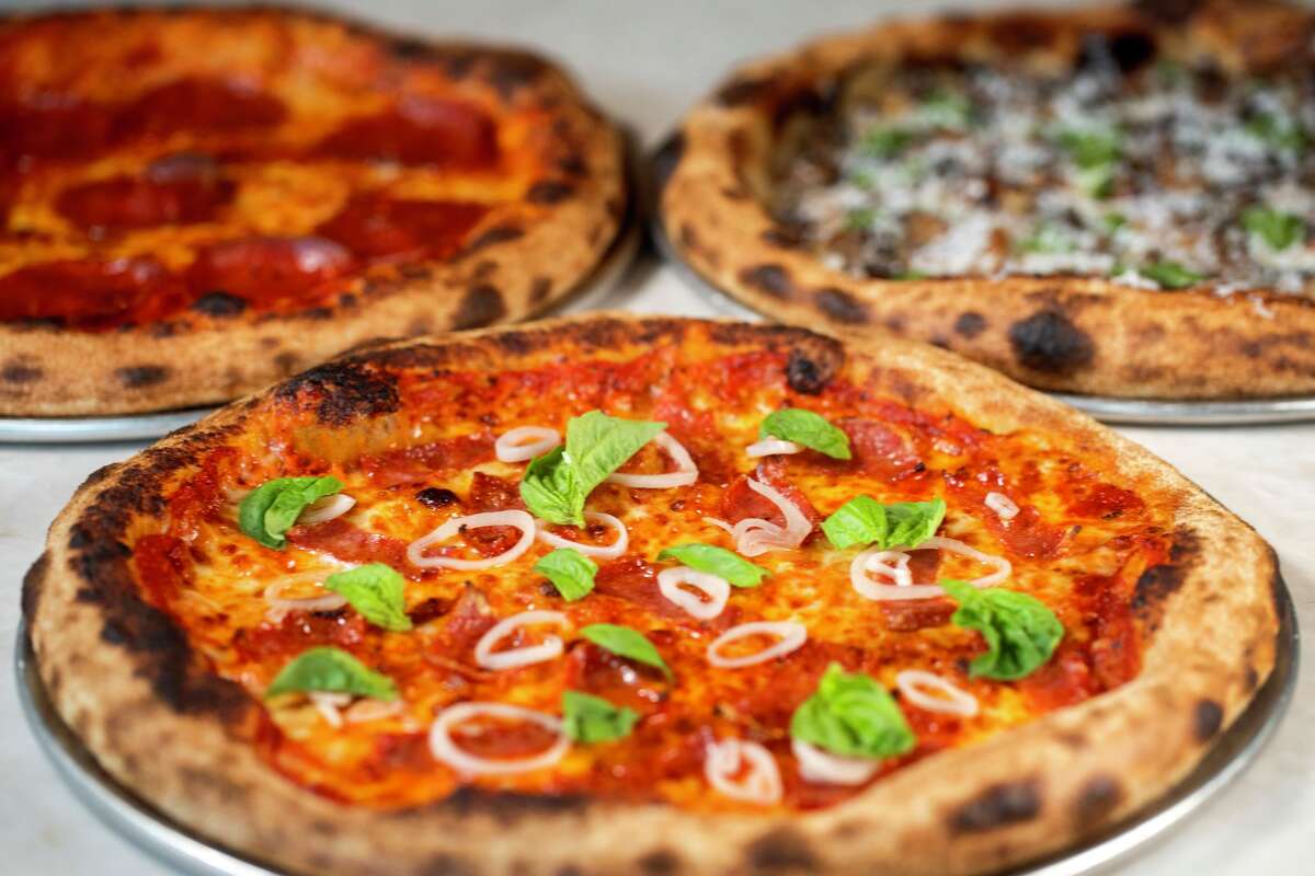 The Not-Hawaiian pizza along with the pepperoni and wild mushroom pizza from Murray's Pizza & Wine are seen in Houston, Friday, Jan. 23, 2026.