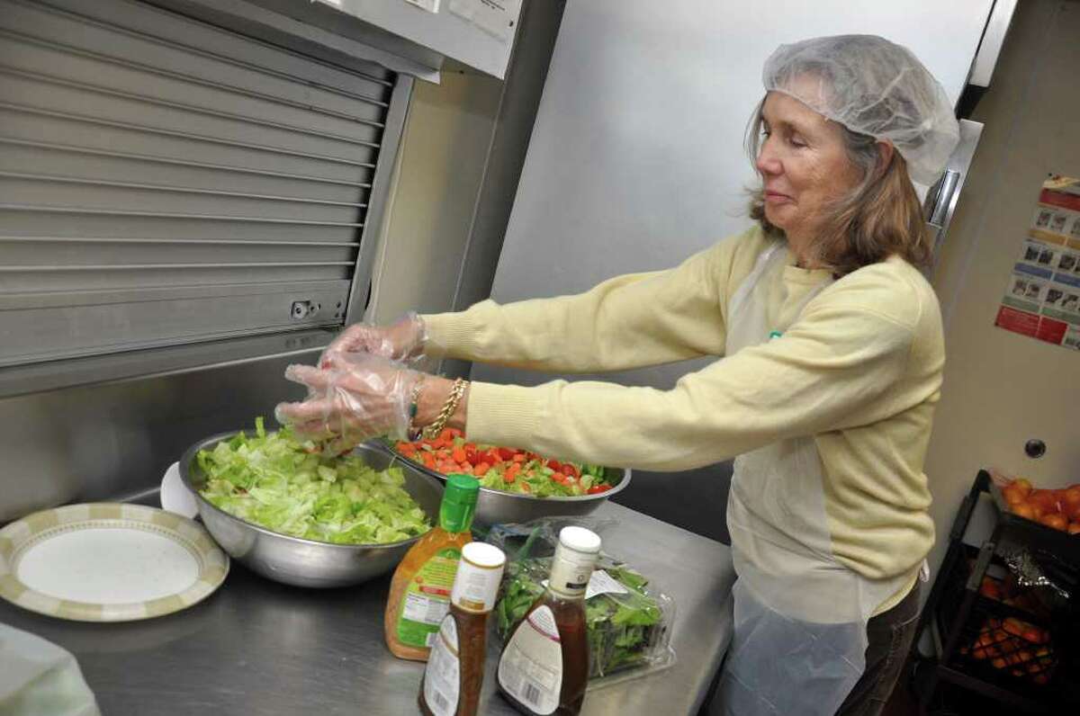 Sara Rehmberg prepares a salad in the kitchen at the Shelter for the Homeless on Pacific Street in Stamford on Thursday, Nov. 18, 2010.