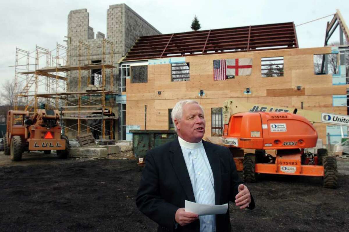 John Branson, Rector at Christ & Holy Trinity Episcopal Chursh in Westport, speaks during the topping off ceremony of the new Great Hall that is under construction.