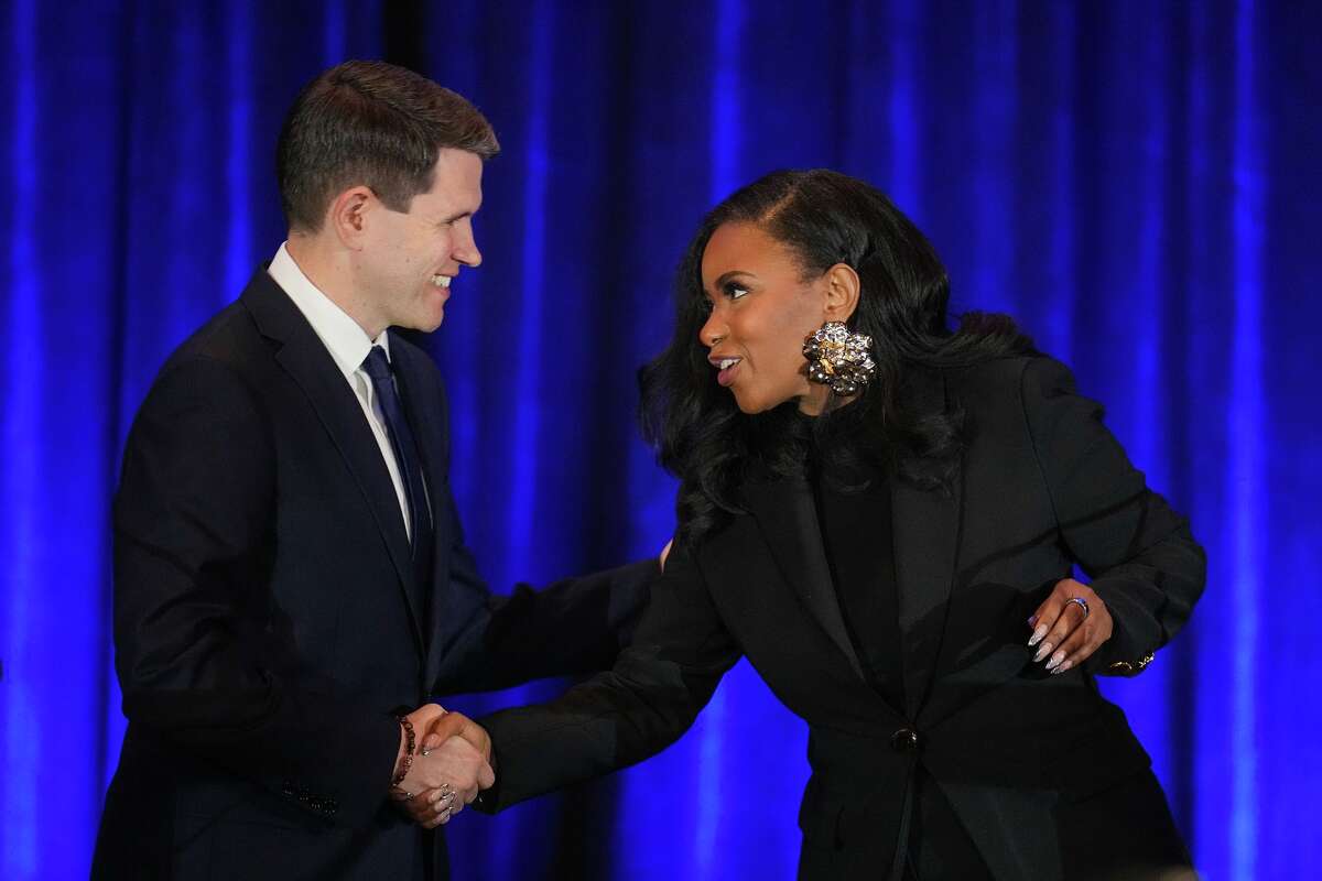 Texas state Rep. James Talarico, D-Austin, left, shakes hands with Rep. Jasmine Crockett, D-Texas, prior a debate during the Texas AFL-CIO Committee on Political Education Convention, Saturday, Jan. 24, 2026, in Georgetown, Texas. (Bob Daemmrich/Texas Tribune via AP, Pool)