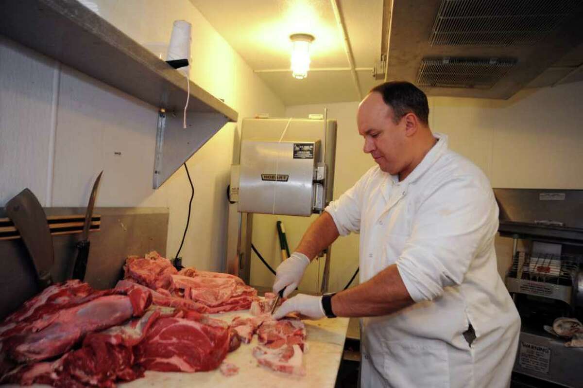 Banker spends workday at local butcher shop