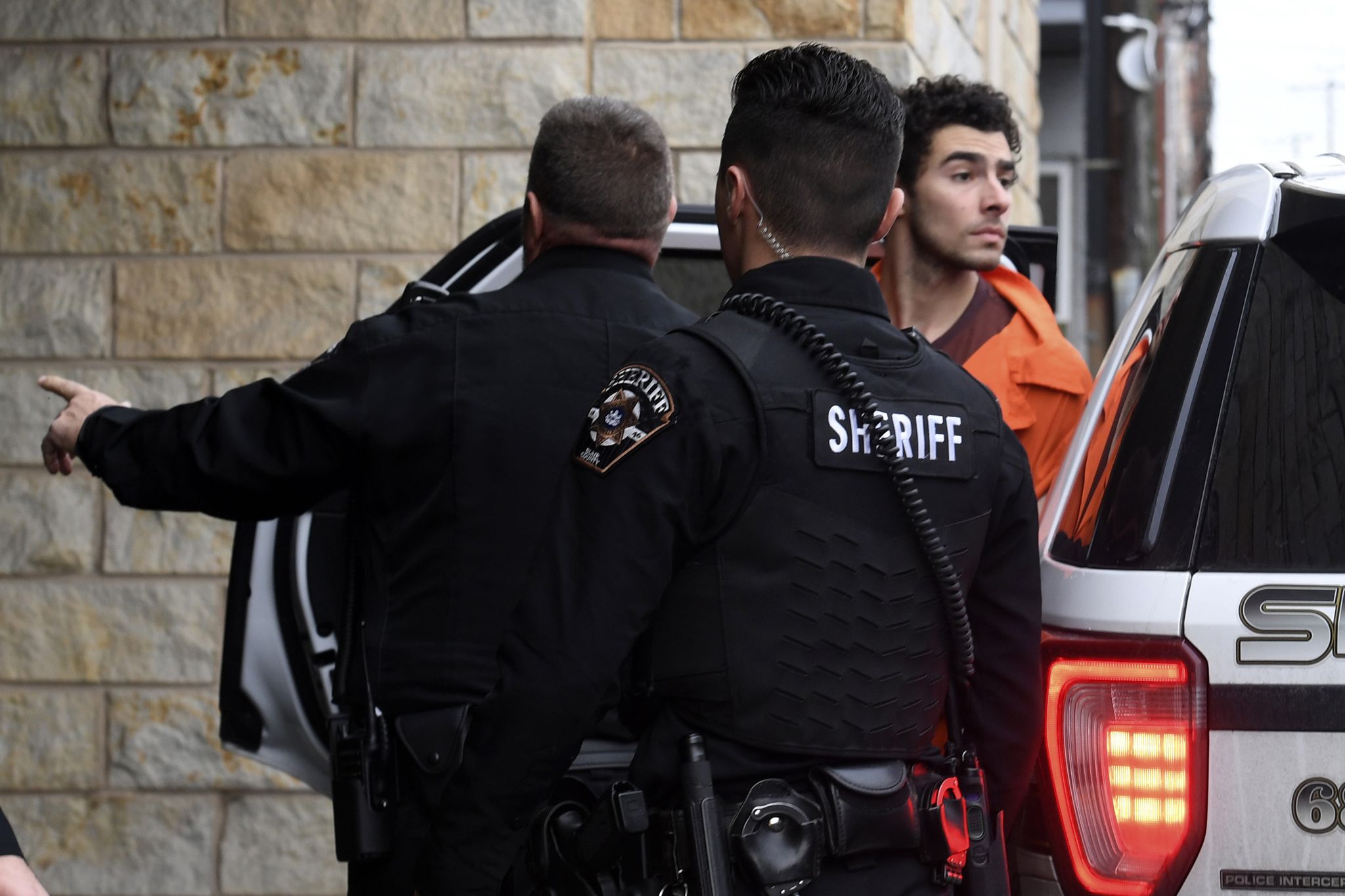 Suspect in killing of UnitedHealthcare's CEO struggles, shouts while ...