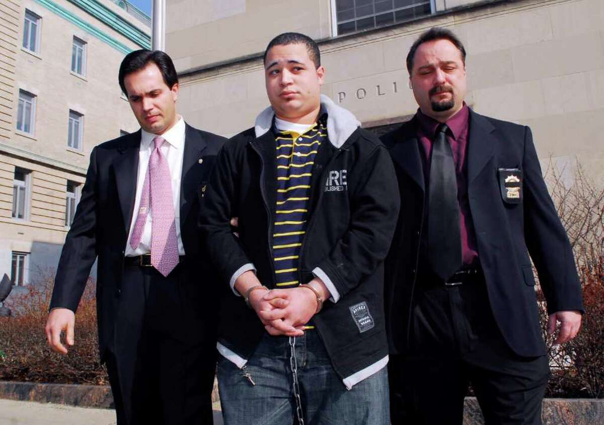 In this March 2008 file photo, Leonard Trujillo, of Worcester, Mass., is led from Greenwich police headquarters by Greenwich detectives to be arraigned for the April 2006 murder of Greenwich resident Andrew Kissel. Trujillo, who has since taken a plea deal in the case, testified Friday at state Superior Court in Stamford in the trial of his cousin, Carlos Trujillo, who is accused of murdering Kissel.