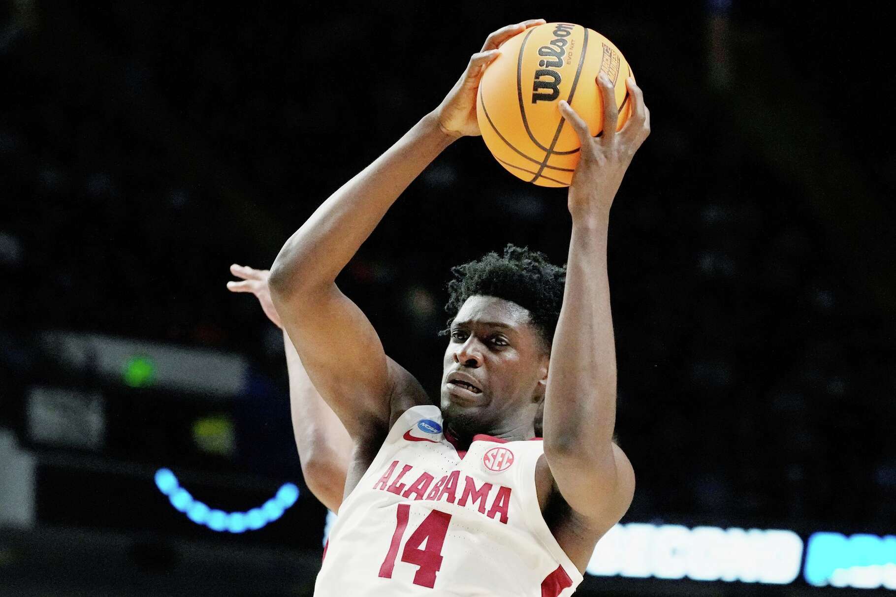 FILE - Alabama center Charles Bediako (14) pulls down a rebound while guarded by Maryland guard Ian Martinez, left, during the second half of a second-round college basketball game in the men's NCAA Tournament in Birmingham, Ala., March 18, 2023.