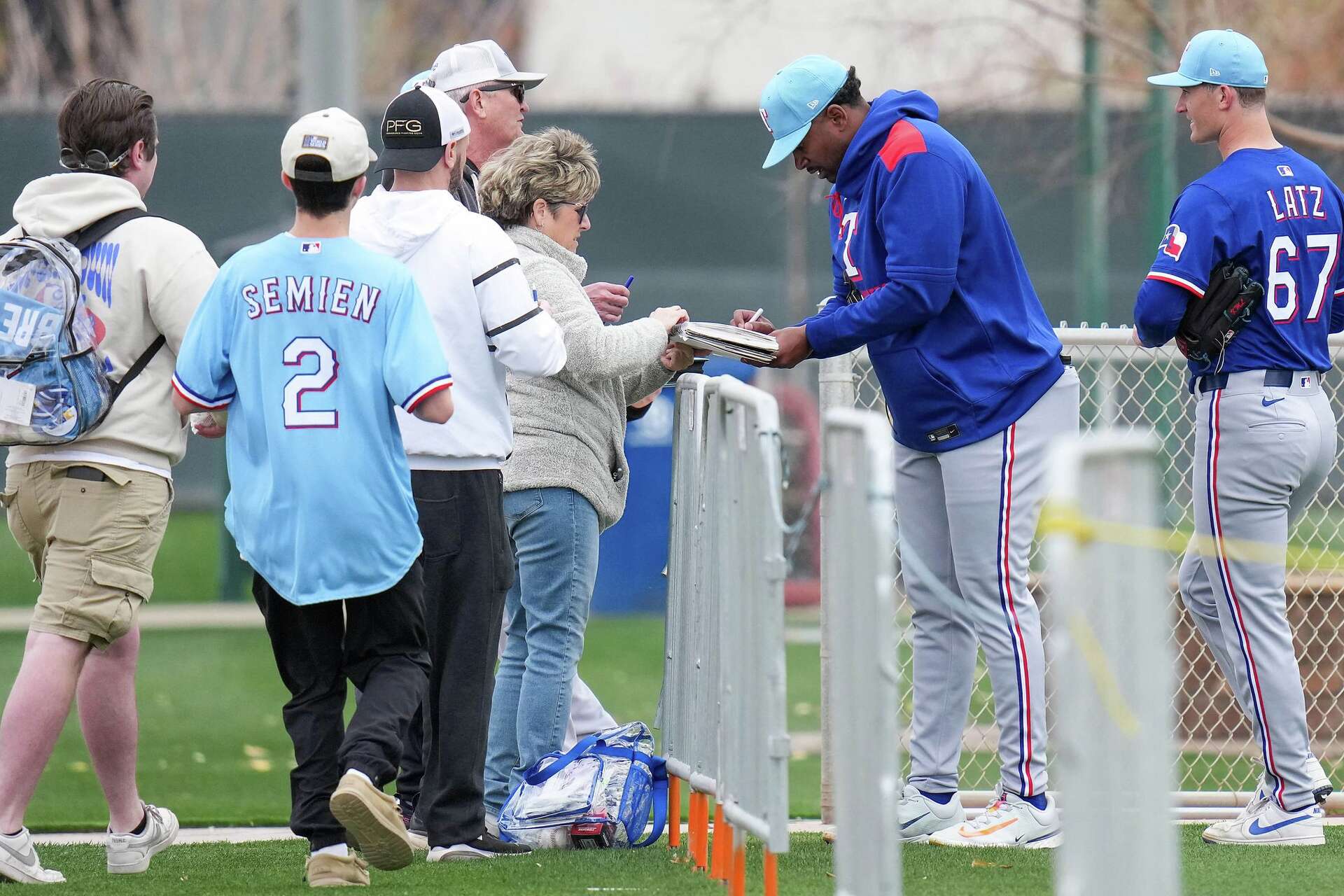 Where do fans get autographs at Texas Rangers spring training?