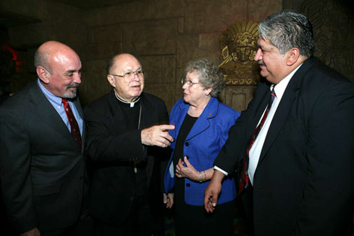 Carlos Guerra, Archbishop Patrick Flores, Sister Charlene Wedelich CDP and Hector Galan were at the Aztec on the River Theater on October 6, 2007 for the screening of the film about Flores. Photo special to the Express-News