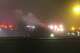 This image taken from video provided by WABI television, emergency services work on a scene of the Bombardier Challenger 600 crash at the Bangor Airport in Maine, late Sunday, Jan. 25, 2026. (WABI via AP)