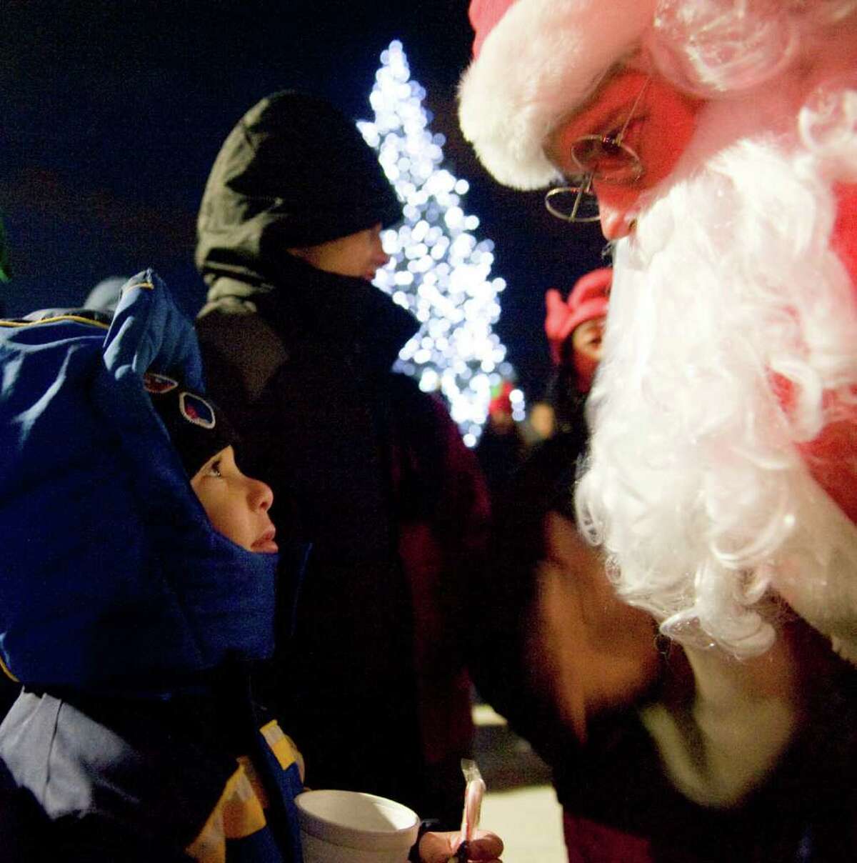 Malaki Benotmane, 4, chats with Santa Claus as Building and Land Technology, the developer of Harbor Point, hosts a tree-lighting ceremony for the first time in Commons Park, a public space newly built as part of Harbor Point in Stamford, Conn., Monday, December 6, 2010.