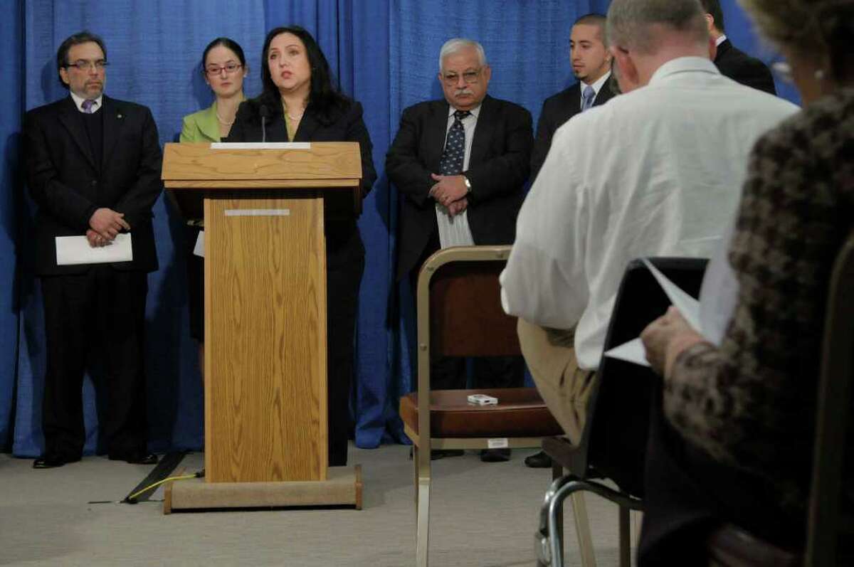 Lorena Diana, at podium, with Upstate New York Hispanic Chamber of Commerce and the Hispanic Coalition, along with other representatives from Latino advocacy groups hold a press conference at the Legislative Office Building in Albany on Monday, Dec. 6, 2010 to introduce a position paper for Gov.-elect Andrew Cuomo with 12 recommendations for changes needed to allow Latino communities to have important roles in the new administration. (Paul Buckowski / Times Union)