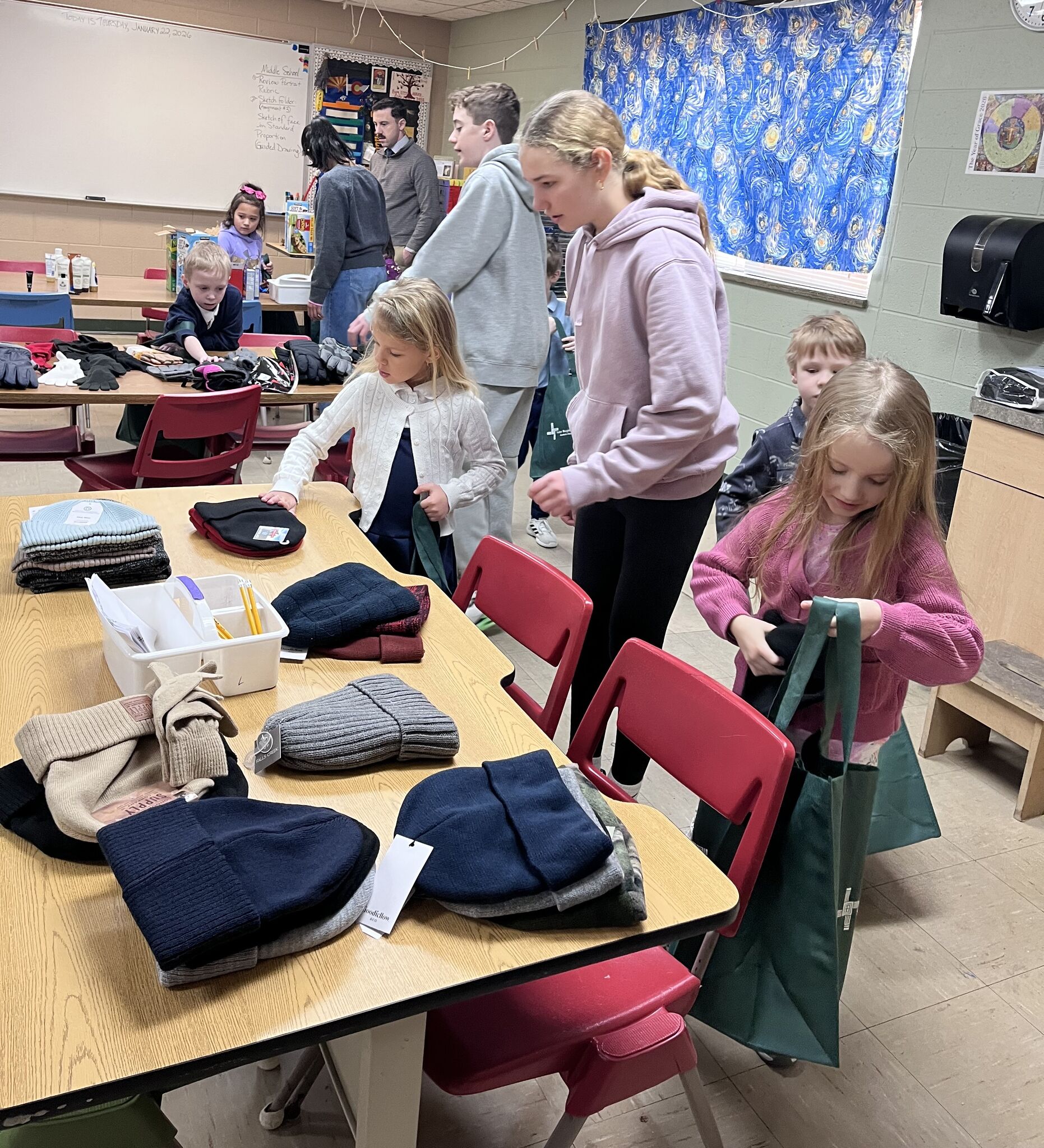 St. Brigid students assemble 30 blessing bags for Open Door during Catholic Schools Week