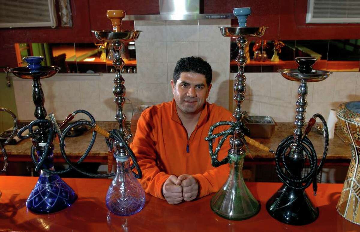 Sammer Karout poses at his hookah lounge in Milford, Conn. on Tuesday December 7, 2010, which has been sitting empty because of his battle with Milford Health Department over the past two years. Karout also own and operates the Olive Tree, a Middle Eastern restaurant next door to the lounge.