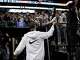 San Antonio Spurs forward Victor Wembanyama, center, greets fans after an NBA basketball game against the Toronto Raptors, Sunday, April 13, 2025, in San Antonio. (AP Photo/Darren Abate)