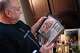 Jeff Metcalf reminisces over the photo collections of his sons Hunter and Austin Metcalf, taken during their family travels, Thursday, April 3, 2025, at his home in Frisco. Austin was killed after he was fatally stabbed during a high school track meet in Frisco on Wednesday, April 2, 2025.