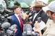 Jake Lang, (left) founder of the group Protect White Americans, and was accused of taking part in the 2021 Capitol riot, holds a conversation with community organizer Bruce Carter in front of the members of the media during a protest held by the group Protect White Americans, on Saturday, April 19, 2025, at David Kuykendall Stadium in Frisco.