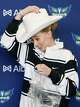 Dallas Wings No. 1 overall pick Paige Bueckers puts on a Stetson cowboy hat during an introductory press conference for the Wings 2025 WNBA draft class at Dallas City Hall, Wednesday, April 23, 2025.
