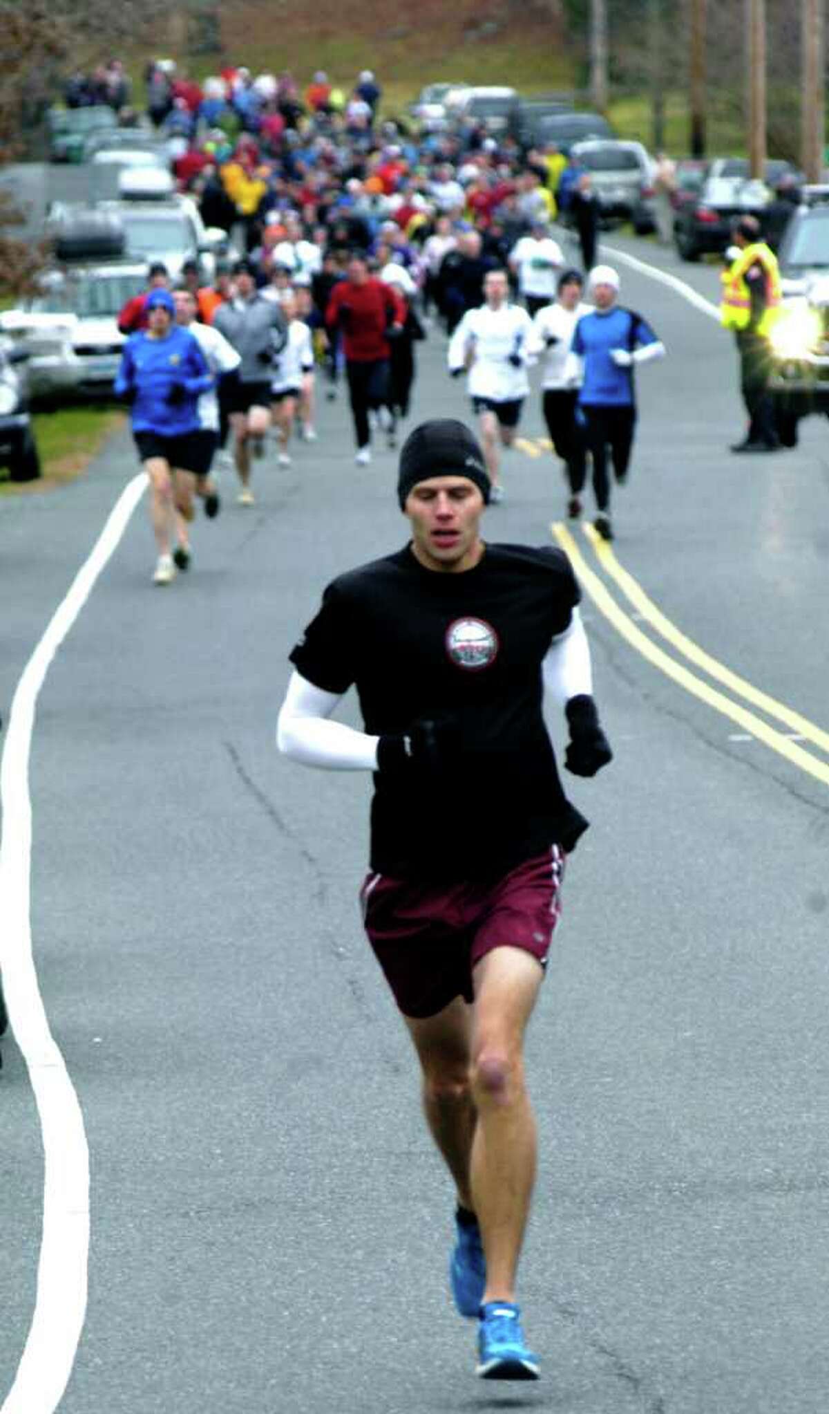 SPECTRUM/Eventual champion Jeff Sheldon of Southbury sprints to a quick lead in the Run for a Cure road race/walk, Nov. 25, 2010 on Thanksgiving in Roxbury.