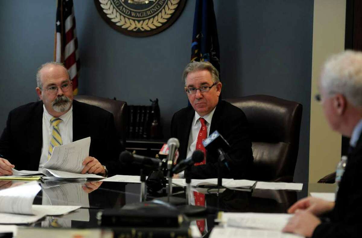 New York State Racing and Wagering Board members Dan Hogan, left, and Chairman John Sabini discuss emergency issues in the face of the closing of the New York City OTB at an emergency board meeting at their offices in Schenectady December 8, 2010. (Skip Dickstein / Times Union)