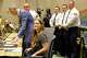 Kate Krause whose life was saved by a transfusion shares her story with Marshal Isaacs, medical director for the Dallas Fire-Rescue, left, and Interim Assistant Chief Scott Pacot, right, during a Dallas City Council meeting, Wednesday, Aug. 20, 2025, in Dallas. Dallas Fire-Rescue paramedics, Marcus Toop, background from left, Joshua Mihalyi and Justin Lovvorn help to save the life of Krause, who is an emergency medicine physician, with an on-scene blood transfusion.
