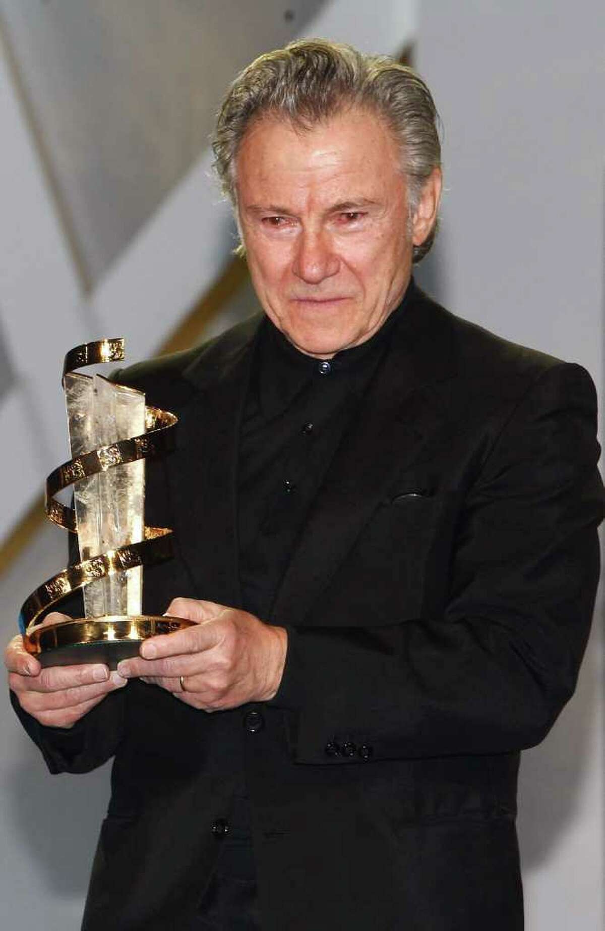 Us actor Harvey Keitel reacts, after receiving an award from US actress Susan Sarandon , during a tribute to his career, at the 10th Marrakech International Film Festival in Marrakech, Wednesday Dec. 8, 2010. The Festival runs through Dec. 3-11. (AP Photo/Abdeljalil Bounhar)
