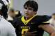 Frisco Memorial High School linebacker Hunter Metcalf (0) listens to a coach during the second half as Frisco Memorial High School hosted Woodrow Wilson High School in a football game played at The Ford Center at The Star In Frisco on Friday, September 5, 2025.